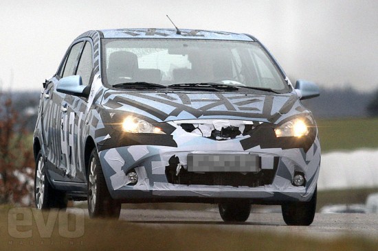 Look like Mazda 2 The vehicle on the spy shots have different bumpers front 